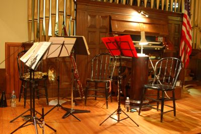 chairs, music stands and instruments on the stage