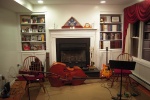 Upright bass on the floor in front of the fireplace